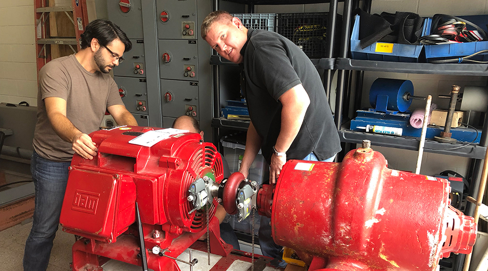 Students working on machinery during a course at the training center